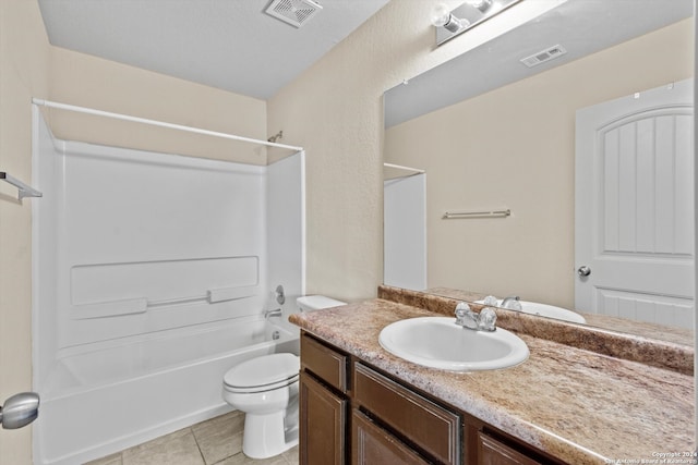 full bathroom featuring vanity, toilet, tile patterned floors, and shower / washtub combination