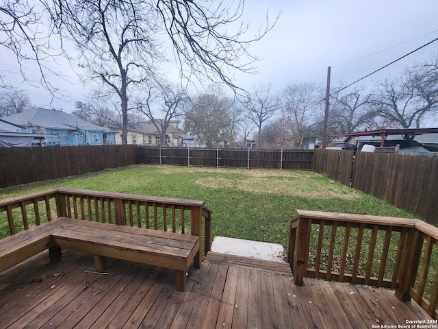 wooden deck with a yard