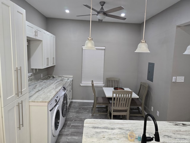 kitchen with light stone countertops, dark wood-type flooring, white cabinetry, and pendant lighting