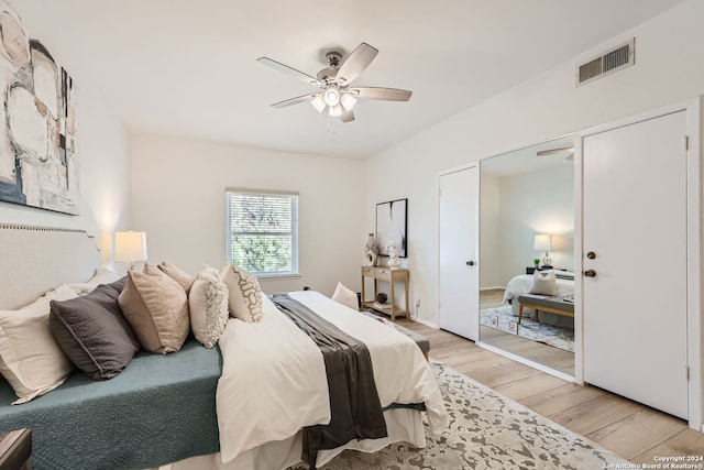 bedroom with ceiling fan and light wood-type flooring