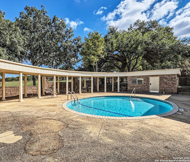 view of pool featuring a patio