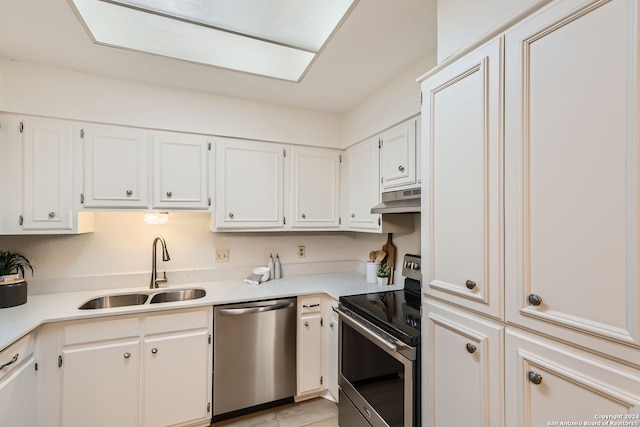 kitchen with sink, white cabinets, and stainless steel appliances