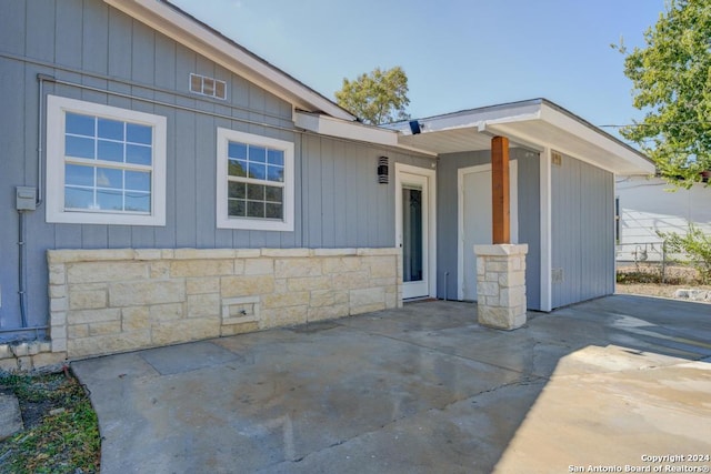 property entrance with a patio area