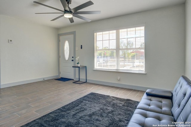 interior space with light wood-type flooring and ceiling fan