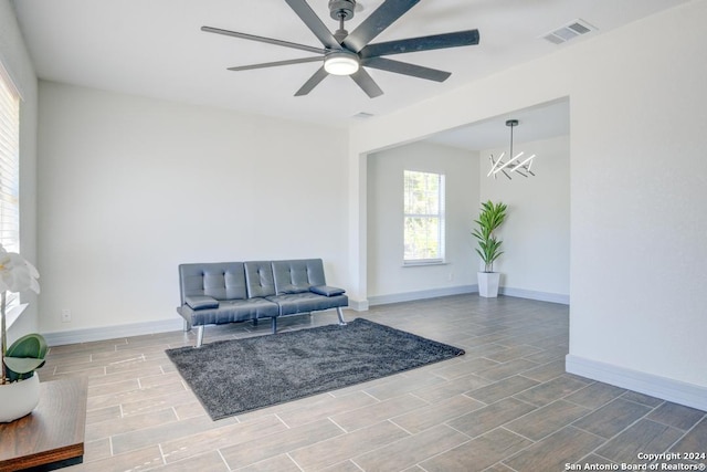 sitting room featuring hardwood / wood-style flooring and ceiling fan