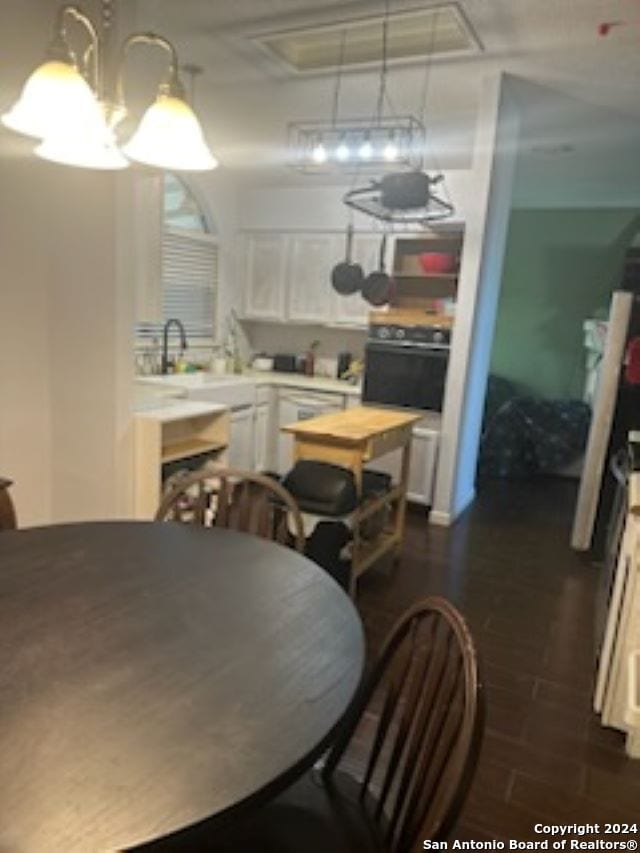 dining area featuring dark hardwood / wood-style floors and sink