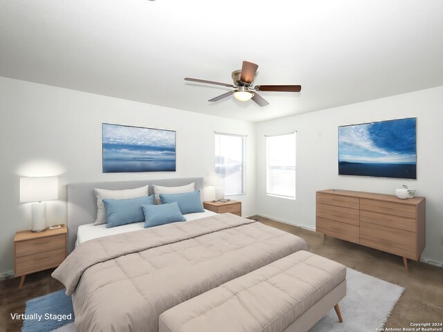 bedroom with carpet flooring, baseboards, and a ceiling fan