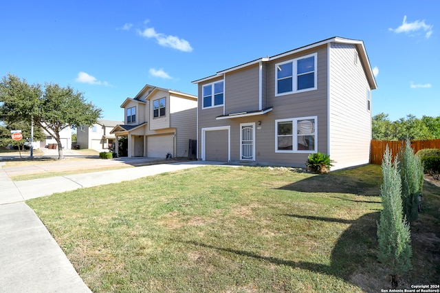 view of front of house featuring a garage and a front lawn