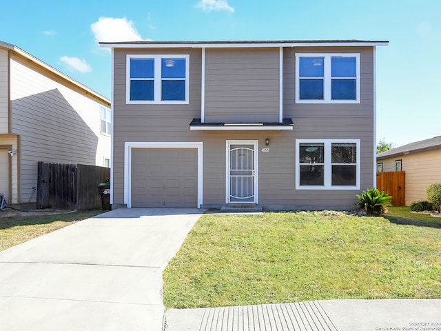 view of front facade with a front yard and a garage