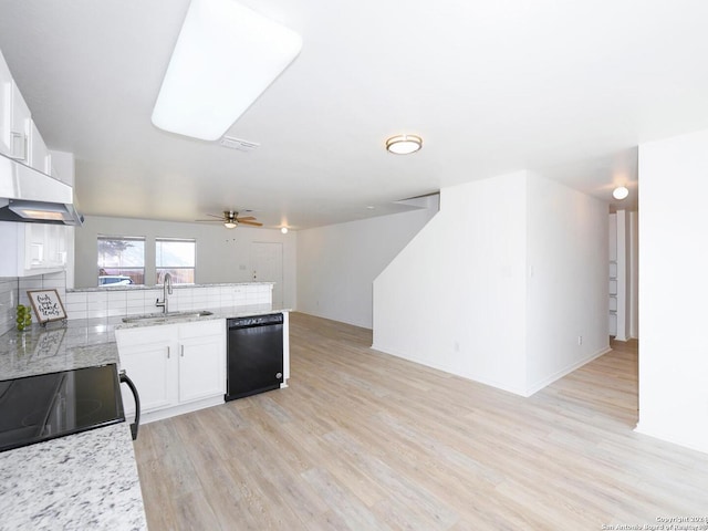 kitchen with backsplash, white cabinets, sink, light hardwood / wood-style flooring, and black dishwasher