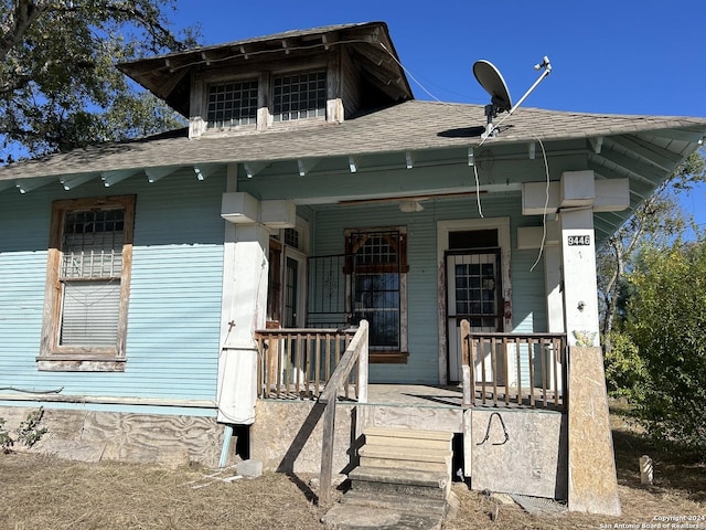 9446 Espada, San Antonio, TX 78214 - view of front of home featuring a shingled roof and covered porch