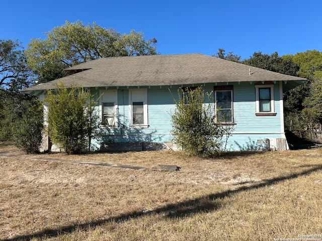 view of home's exterior with a lawn