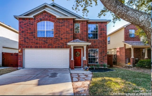 view of front facade featuring a front yard and a garage