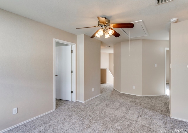 spare room featuring light carpet