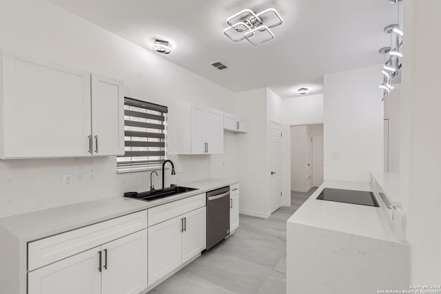 kitchen featuring black electric stovetop, sink, stainless steel dishwasher, and white cabinets