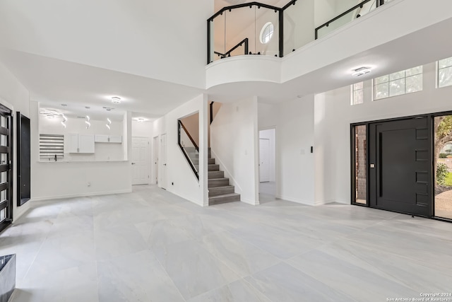 foyer featuring a high ceiling