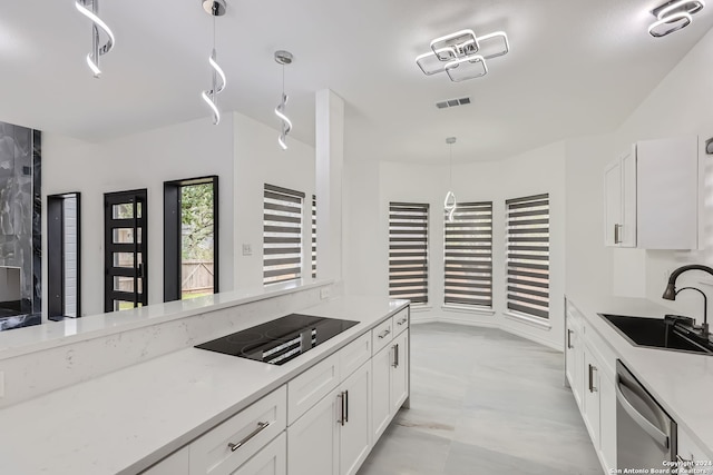 kitchen with white cabinets, dishwasher, black electric stovetop, decorative light fixtures, and sink