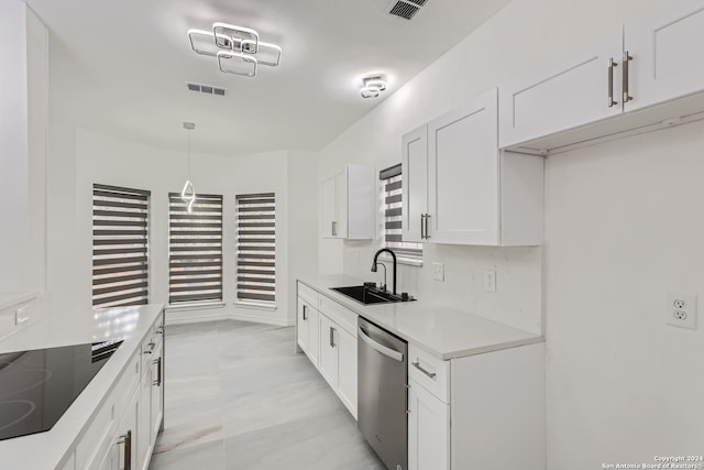 kitchen featuring white cabinetry, dishwasher, black electric stovetop, decorative light fixtures, and sink