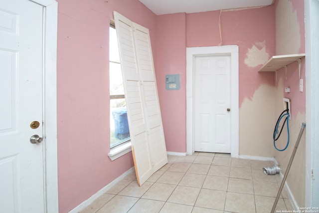 laundry area featuring light tile patterned flooring and washer hookup