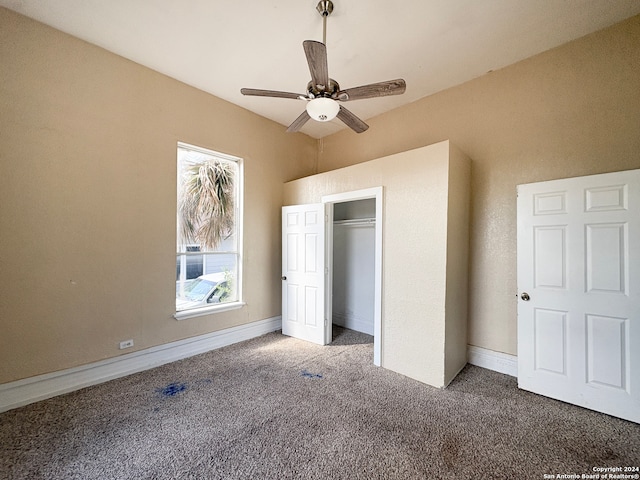 unfurnished bedroom with carpet flooring, a closet, and ceiling fan