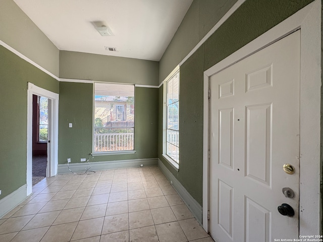 view of tiled foyer entrance