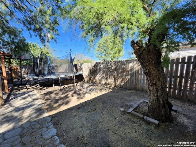 view of yard with a trampoline