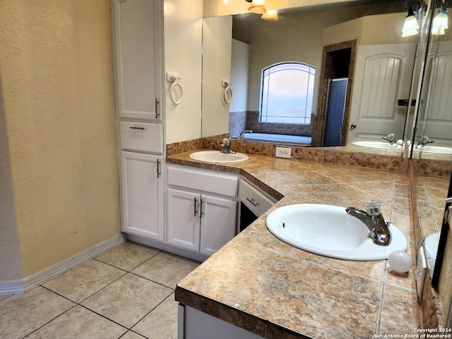 bathroom featuring vanity, tile patterned flooring, and plus walk in shower