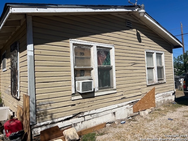 view of side of property featuring cooling unit