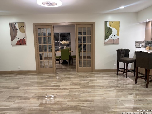 interior space with recessed lighting and baseboards