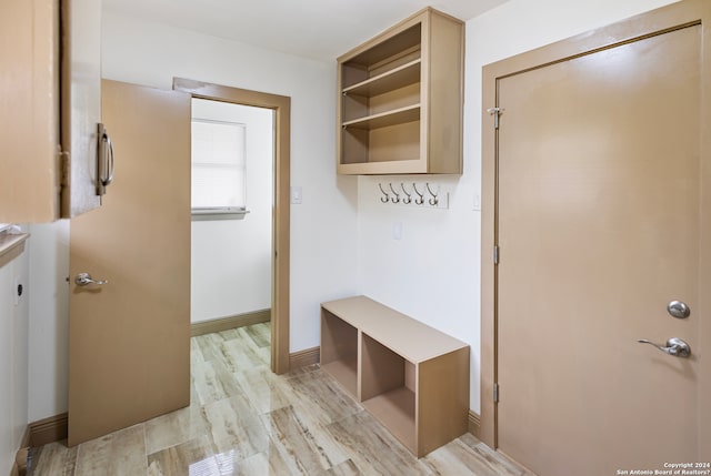 mudroom with light hardwood / wood-style floors