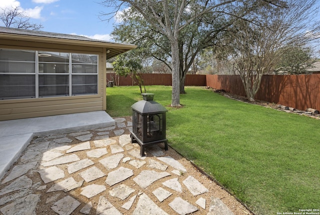 view of yard with a patio and a fenced backyard