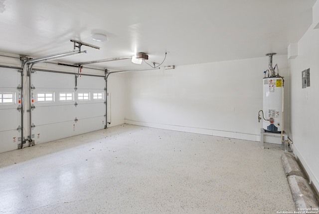 garage with a garage door opener and water heater