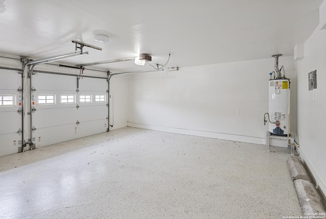 garage featuring gas water heater and a garage door opener