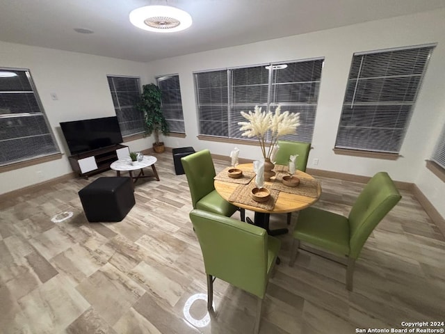 dining area featuring baseboards