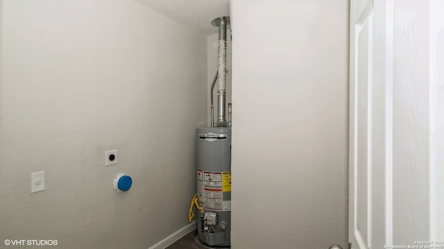 utility room with gas water heater