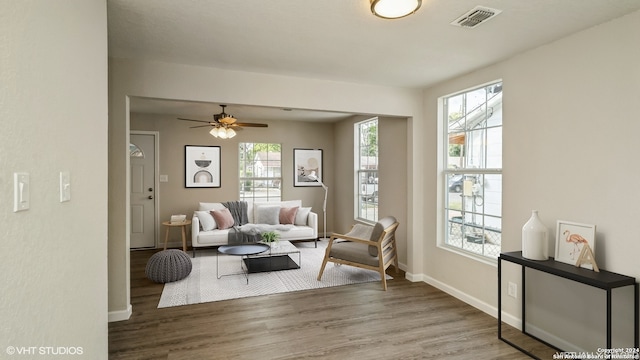 living room featuring hardwood / wood-style flooring and ceiling fan