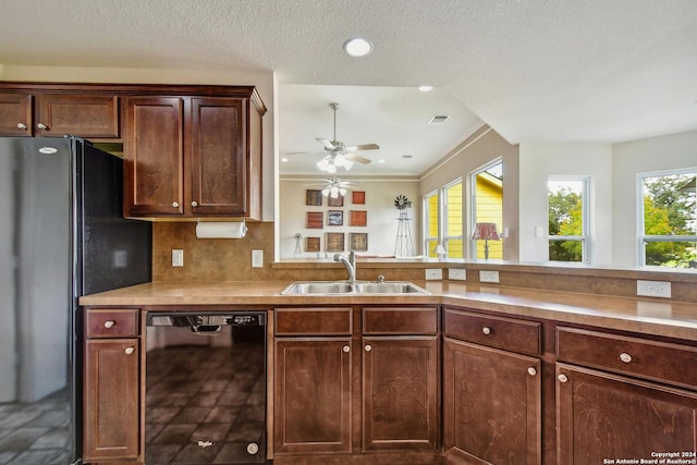 kitchen with a textured ceiling, dishwasher, refrigerator, crown molding, and sink