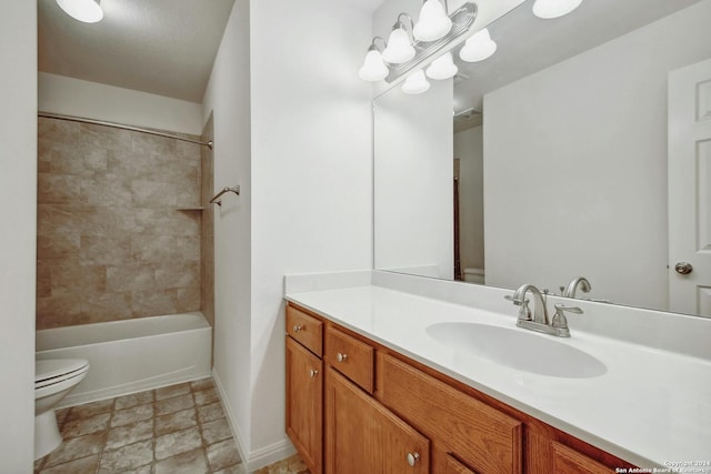 full bathroom with vanity, toilet, and tiled shower / bath combo