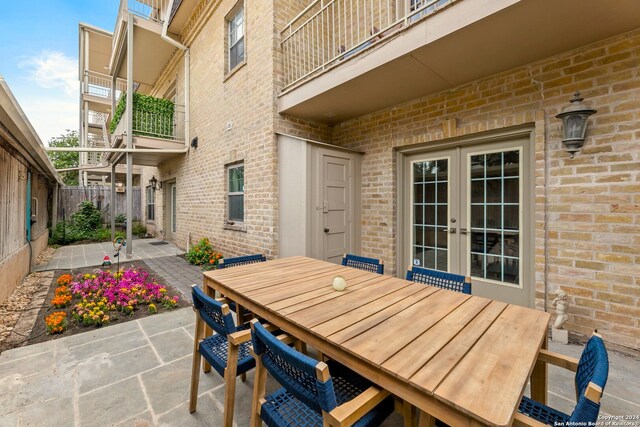 view of patio featuring a balcony