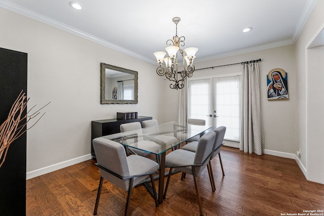 dining area featuring crown molding, a notable chandelier, and dark hardwood / wood-style flooring