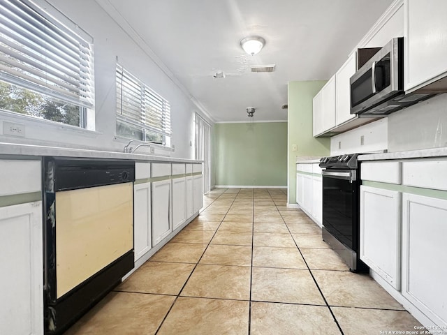 7114 Teton Rdg, San Antonio, TX 78233 - kitchen featuring stainless steel appliances, light tile patterned flooring, crown molding, visible vents, and white cabinets