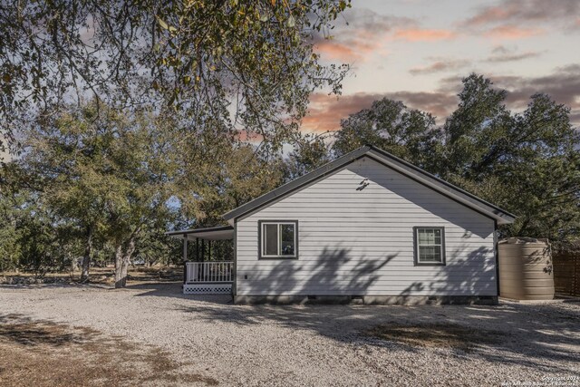 1627 Forest Lake Dr, Spring Branch, TX 78070 - property exterior at dusk featuring crawl space