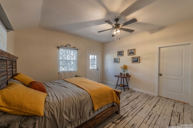 bedroom with ceiling fan and lofted ceiling