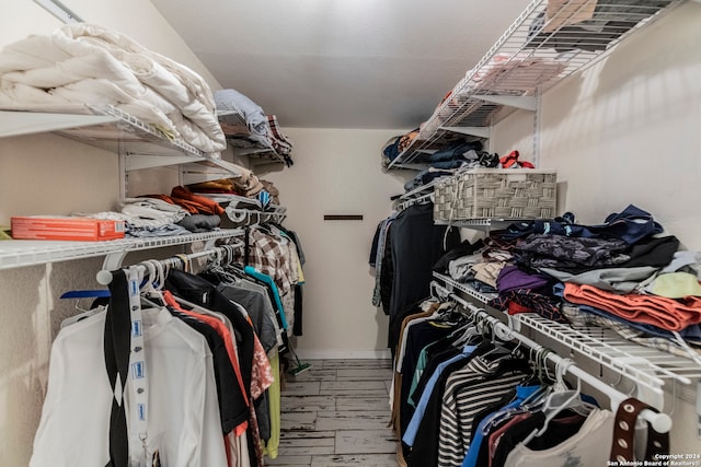 spacious closet featuring hardwood / wood-style flooring