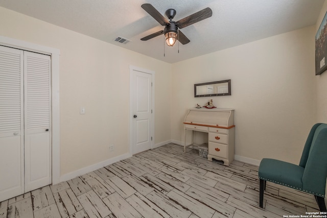 interior space featuring ceiling fan