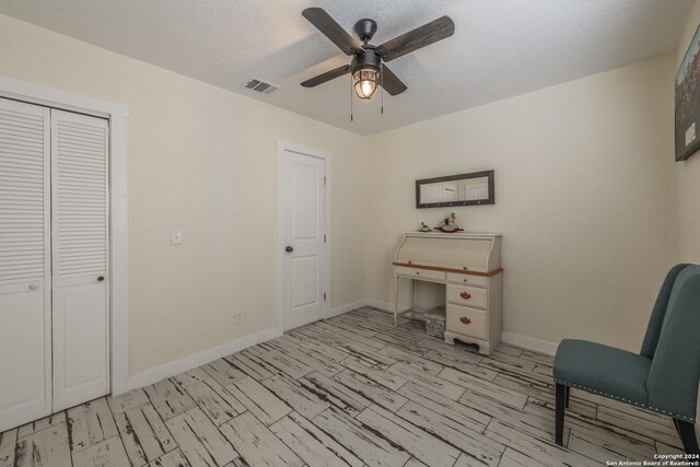1627 Forest Lake Dr, Spring Branch, TX 78070 - home office with baseboards, a ceiling fan, and visible vents