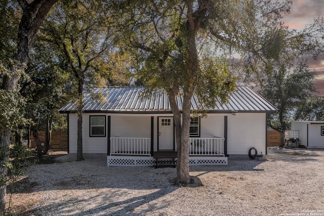 ranch-style home with covered porch