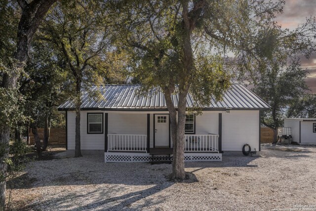 1627 Forest Lake Dr, Spring Branch, TX 78070 - view of front of house with a porch and metal roof