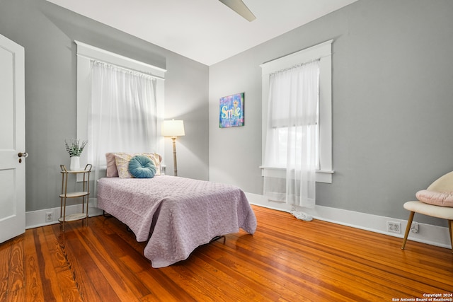 bedroom featuring ceiling fan and dark hardwood / wood-style flooring