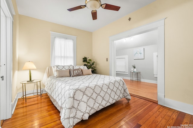 bedroom featuring light hardwood / wood-style flooring and ceiling fan